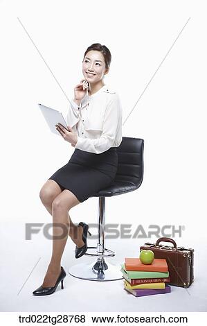 woman holding tablet View Large Photo Image Stock Photo - woman holding tablet. Fotosearch