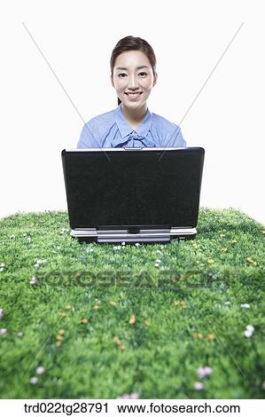 Stock Image - woman working using laptop. Fotosearch