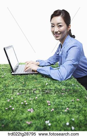 Stock Photography - woman working using laptop. Fotosearch