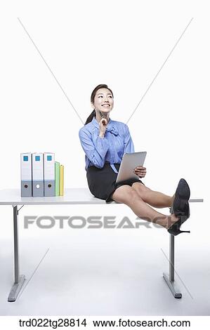 Picture - working business woman. Fotosearch