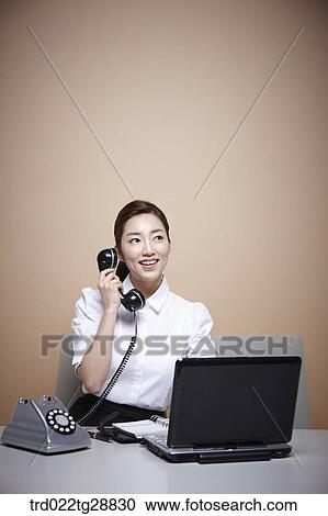 Stock Image - working woman customer service. Fotosearch