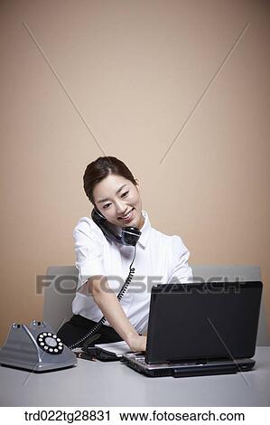 Stock Image - working woman customer service. Fotosearch