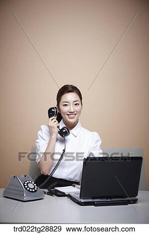Stock Photo - working woman customer service. Fotosearch