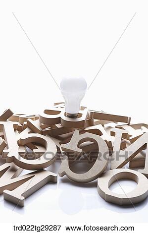 Stock Photo - bulb and alphabet initials. Fotosearch