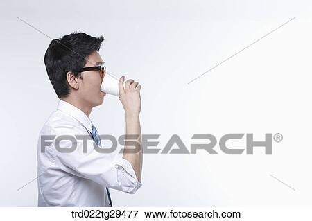 business man is drinking something View Large Photo Image Stock Photo - business man is drinking something. Fotosearch