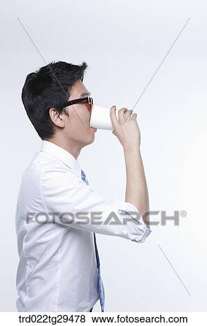 business man is drinking something View Large Photo Image Stock Photo - business man is drinking something. Fotosearch