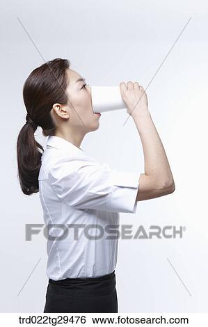 business woman is drinking something View Large Photo Image Stock Photograph - business woman is drinking something. Fotosearch