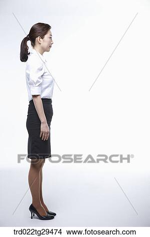Picture - business woman is standing. Fotosearch