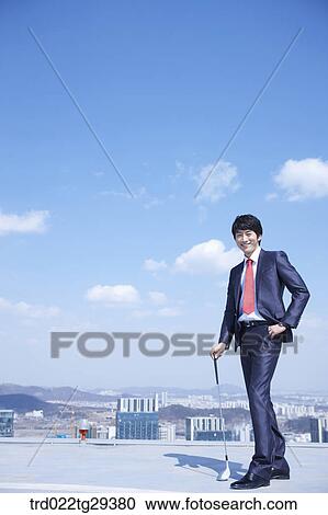 businessman holding golf club View Large Photo Image Stock Image - businessman holding golf club. Fotosearch