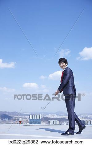 businessman holding golf club View Large Photo Image Stock Image - businessman holding golf club. Fotosearch