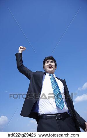 Stock Photography - businessman raising his arms. Fotosearch