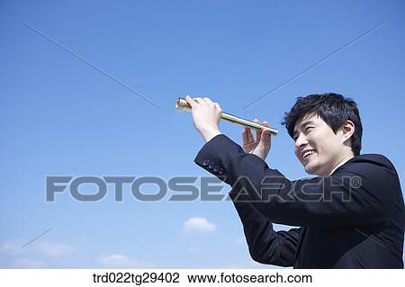 businessman see the scape through the telelscope View Large Photo Image Stock Image - businessman see the scape through the telelscope. Fotosearch
