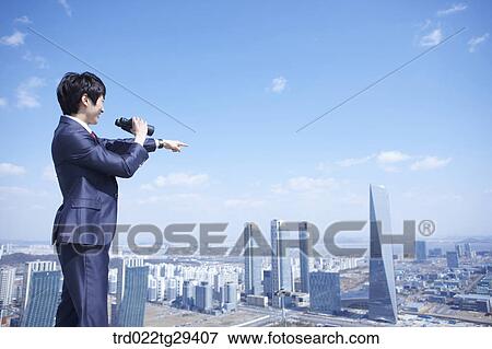 businessman see the scape through the telelscope View Large Photo Image Stock Photo - businessman see the scape through the telelscope. Fotosearch