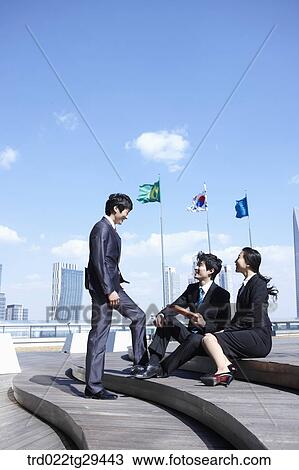 Stock Image - businessman talking on the stairs . Fotosearch