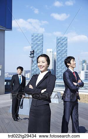 Picture - businessmen crossed their arms. Fotosearch
