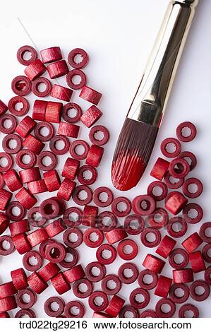 Stock Photograph - red color rolls and brushes. Fotosearch