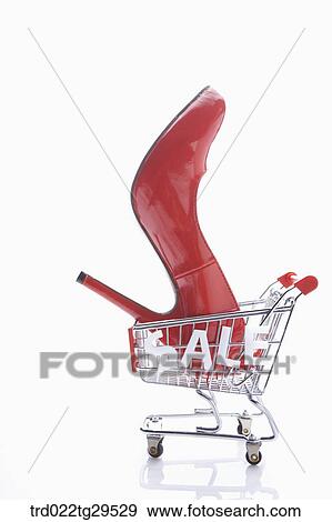red high heels in the shopping cart View Large Photo Image Stock Photo - red high heels in the shopping cart. Fotosearch