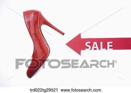 Stock Image - red high heels with sale tag. Fotosearch