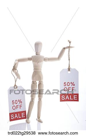 wooden doll holding sale tags View Large Photo Image Stock Photo - wooden doll holding sale tags. Fotosearch