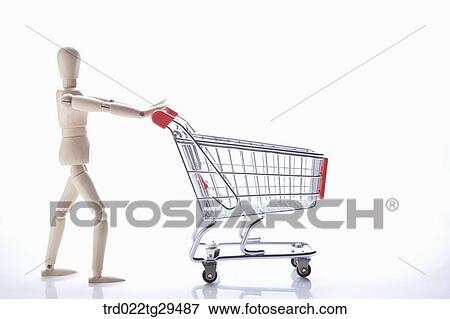 wooden doll pushing shopping cart View Large Photo Image Stock Photo - wooden doll pushing shopping cart. Fotosearch
