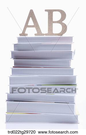 Stock Image - alphabets and piled books. Fotosearch