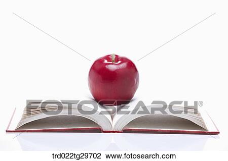 apple on the opened book View Large Photo Image Stock Image - apple on the opened book. Fotosearch