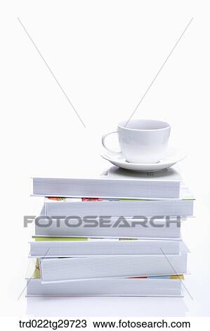 coffee cup on piled books View Large Photo Image Stock Image - coffee cup on piled books. Fotosearch