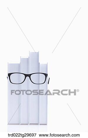 glasses on the piled books View Large Photo Image Stock Photo - glasses on the piled books. Fotosearch