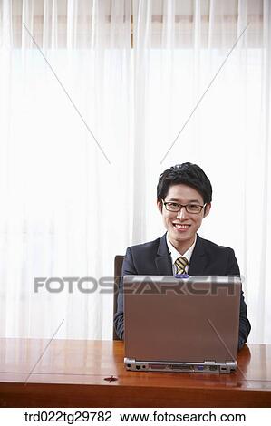 man doing his work using laptop View Large Photo Image Stock Image - man doing his work using laptop. Fotosearch