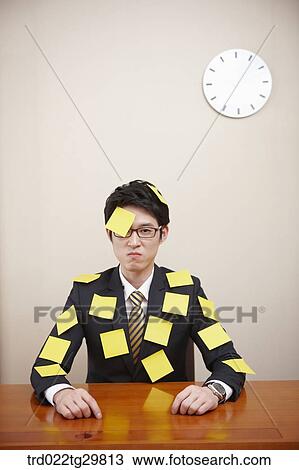 man is attching memo pad on his forehead and suit View Large Photo Image Stock Image - man is attching memo pad on his forehead and suit. Fotosearch