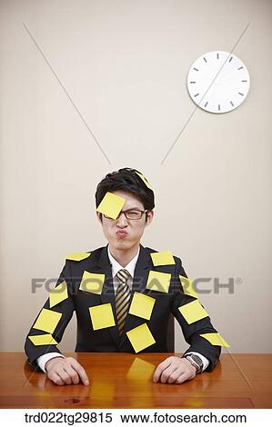 man is attching memo pad on his forehead and suit View Large Photo Image Stock Photography - man is attching memo pad on his forehead and suit. Fotosearch