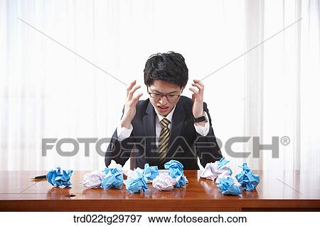 man is frowning with scraps of paper View Large Photo Image Stock Photo - man is frowning with scraps of paper. Fotosearch