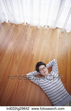 man lied with his arm under his head View Large Photo Image Stock Image - man lied with his arm under his head. Fotosearch