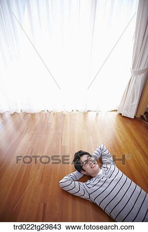 man lied with his arm under his head View Large Photo Image Stock Image - man lied with his arm under his head. Fotosearch