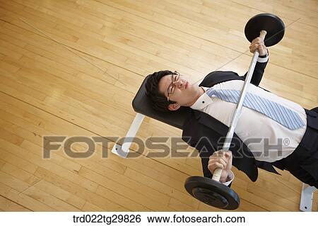 man lifts weights View Large Photo Image Stock Photograph - man lifts weights. Fotosearch