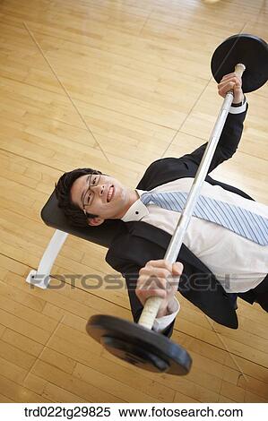 man lifts weights View Large Photo Image Stock Photography - man lifts weights. Fotosearch