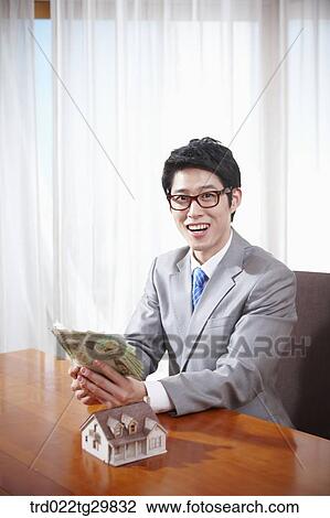 Stock Image - man satisfied with money. Fotosearch