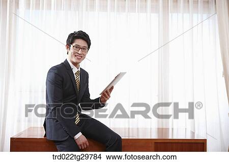 man touching tablet pc View Large Photo Image Picture - man touching tablet pc. Fotosearch