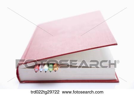 Stock Image - pencils in books. Fotosearch