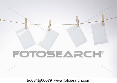 Stock Photo - polaroid films hanging washing line. Fotosearch