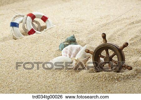 Stock Photograph - props of summer on the sand. Fotosearch
