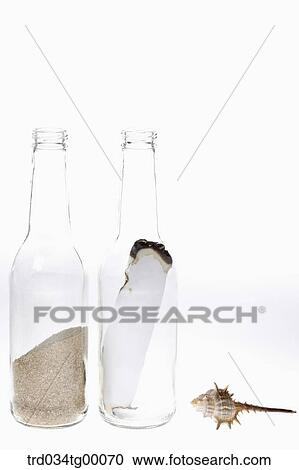 sand in bottle and paper in bottle View Large Photo Image Stock Image - sand in bottle and paper in bottle. Fotosearch