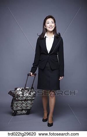 Stock Image - woman carrying carriage. Fotosearch