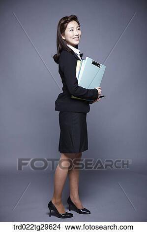 woman holding files View Large Photo Image Picture - woman holding files. Fotosearch