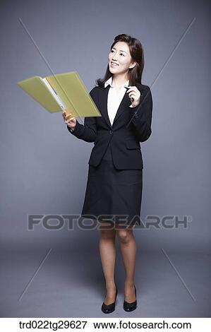 Stock Photo - woman holding files. Fotosearch