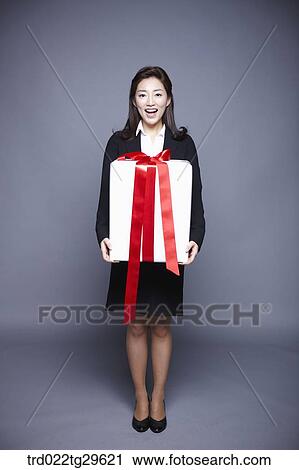 woman holding gift box View Large Photo Image Stock Image - woman holding gift box. Fotosearch