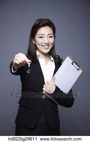 woman holding key View Large Photo Image Stock Image - woman holding key. Fotosearch
