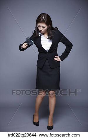 woman holding magnifying glass View Large Photo Image Picture - woman holding magnifying glass. Fotosearch