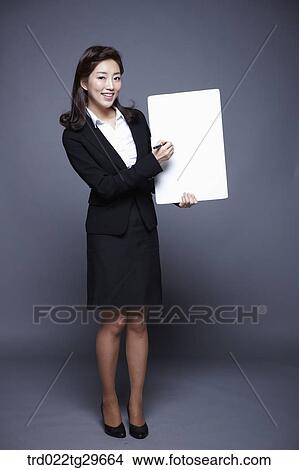 woman holding paper board View Large Photo Image Picture - woman holding paper board. Fotosearch