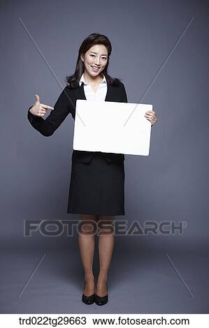 woman holding paper board View Large Photo Image Stock Image - woman holding paper board. Fotosearch